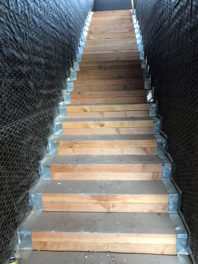Wooden stairs prepped for pli-dek application