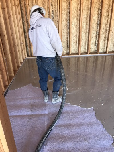 Gypcrete flooring being installed over sound matting underlayment
