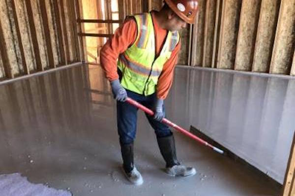 Gypsum flooring being installed in new construction