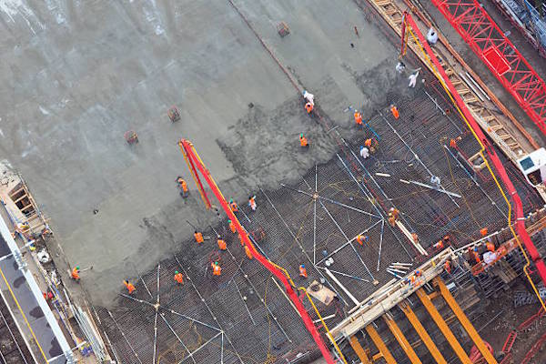 crew working on concrete roof deck